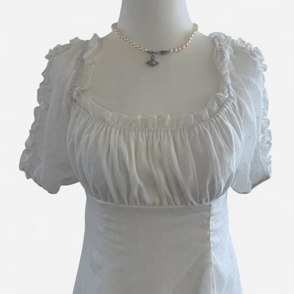 White eyelet babydoll dress with ruffled sleeves and square neckline